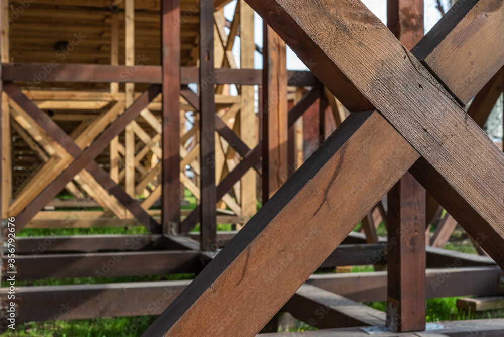 Wooden scaffolding - equipment for the construction and reconstruction of buildings and structures. Prefabricated structure for performing facade - finishing repair work. Wooden scaffolding - equipment for the construction and reconstruction of buildings and structures. Prefabricated structure for performing facade - finishing repair work.