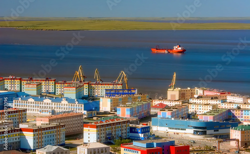 Beautiful top view of the Arctic port town. Panorama of the city of Anadyr. Aerial view of streets, colorful buildings and a cargo ship. Anadyr is the easternmost city of Russia. Chukotka, Siberia. photo