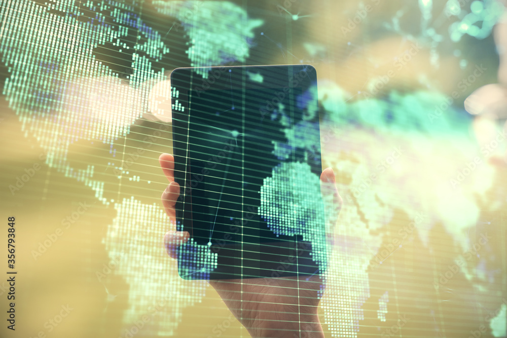 Obraz premium Double exposure of business theme sketch hologram and woman holding and using a mobile device.