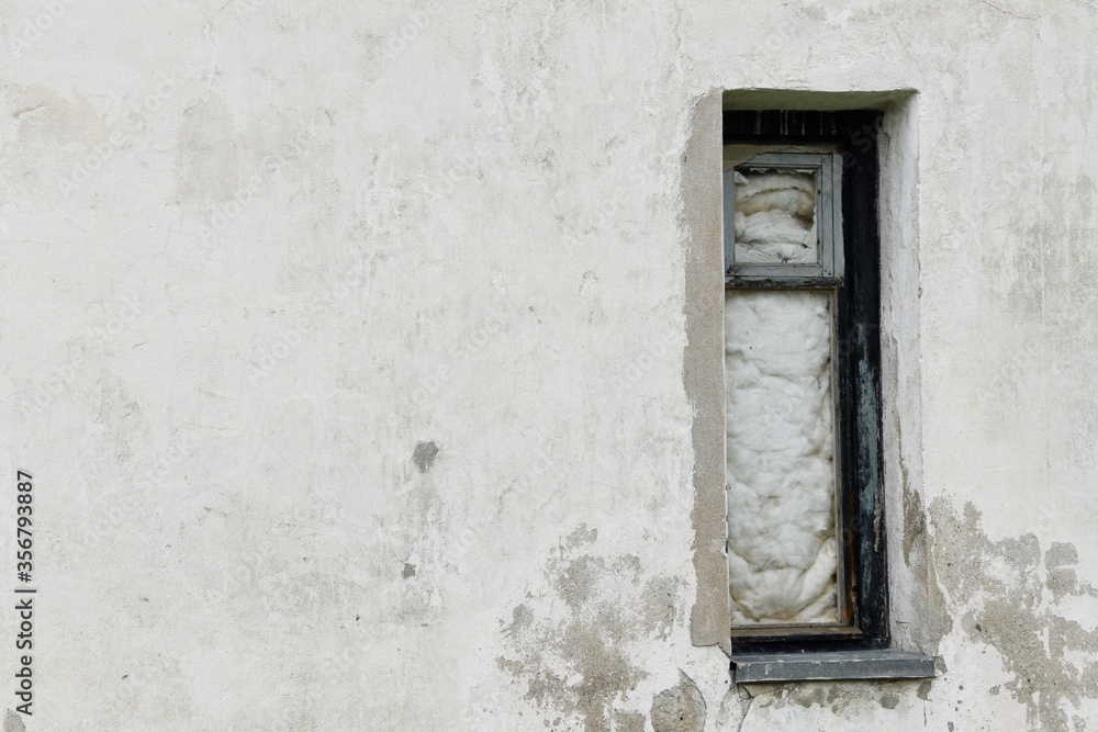 Boarded building window with burnt discolored planks. Boarded building window with burnt discolored planks.