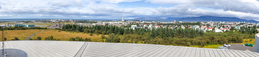 Panoramic aerial view of Reykjavik from a city rooftop in summer season