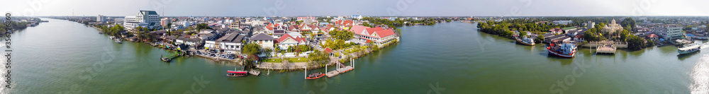 Maeklong, Thailand. Famous railway market and city skyline from city river, panoramic aerial view