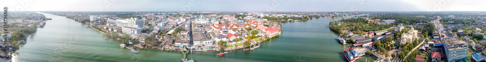 Maeklong, Thailand. Famous railway market and city skyline from city river, panoramic aerial view