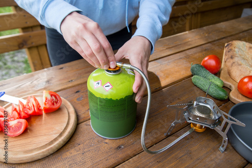 Photos the process of using a gas tourist cylinder for cooking
