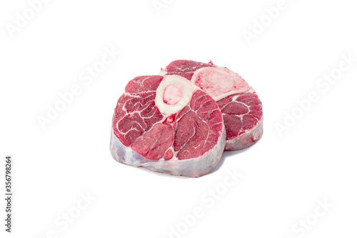 raw veal meat with marrow bone for italian dish Osso Buco cutout on white background