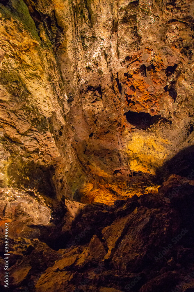 Cueva de los Verdes, Green Cave in Lanzarote. Canary Islands. an amazing lava tube and tourist attraction on Lanzarote island, Spain. Multi-colored illumination of caves. Beautiful cave. Cueva de los Verdes, Green Cave in Lanzarote. Canary Islands. an amazing lava tube and tourist attraction on Lanzarote island, Spain. Multi-colored illumination of caves. Beautiful cave.