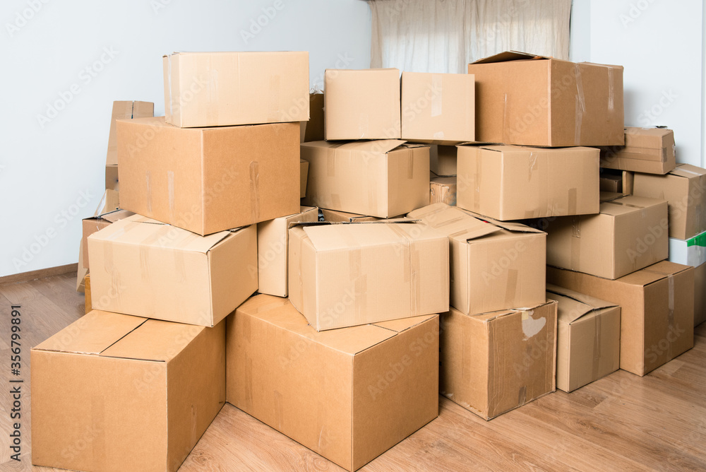 Family loses their home and moves, fills the cardboard boxes for the move due to the crisis. Family loses their home and moves, fills the cardboard boxes for the move due to the crisis.