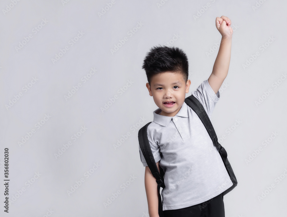 Smart little Asian boy with backpack having fun. School concept. Back to School Smart little Asian boy with backpack having fun. School concept. Back to School