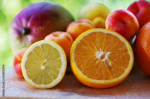 Sliced lemon and orange. Fruits on table