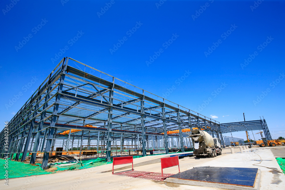 Steel frame structure factory building, in the blue sky and white clouds background