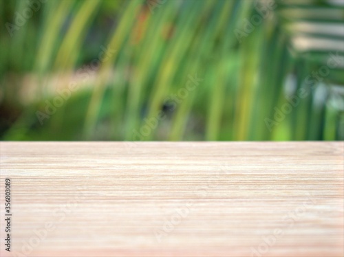 Empty wood table top on blur green leaves garden background ,nature abstract blurred, display product, balnk table	