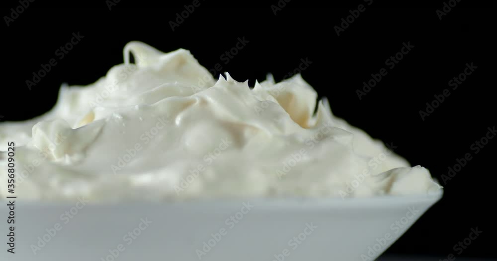 A plate of mascarpone cheese slowly rotates. A plate of mascarpone cheese slowly rotates.