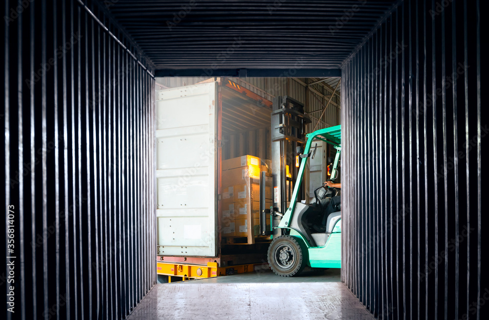 Forklift Tractor Loading Packaging boxes on Pallets into Container ...