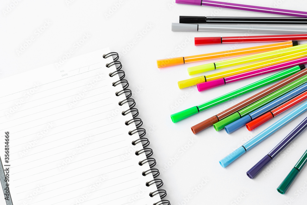 Notebook and Color pen on white background Notebook and Color pen on white background