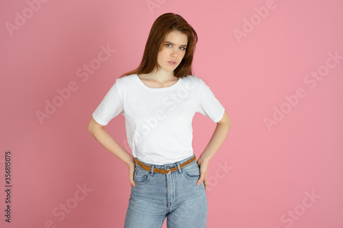 young woman posed on colorful background