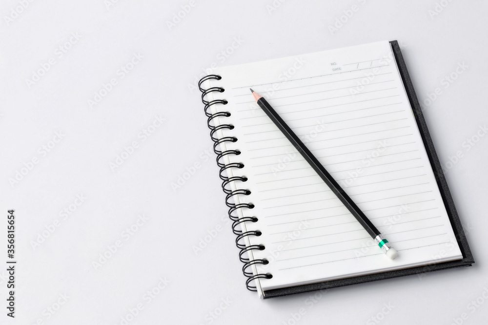 Notebook and pencil on white background Notebook and pencil on white background