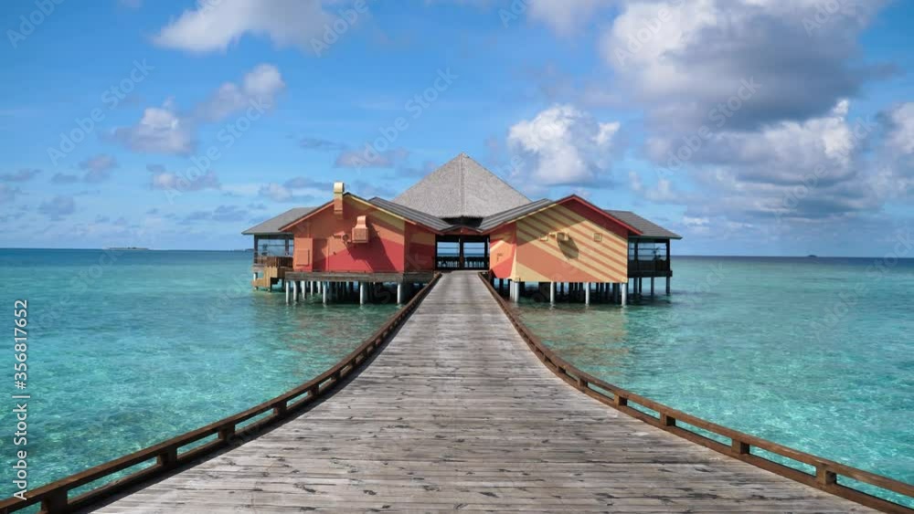 Isolated remote building at the end of jeti over calm blue ocean Isolated remote building at the end of jeti over calm blue ocean