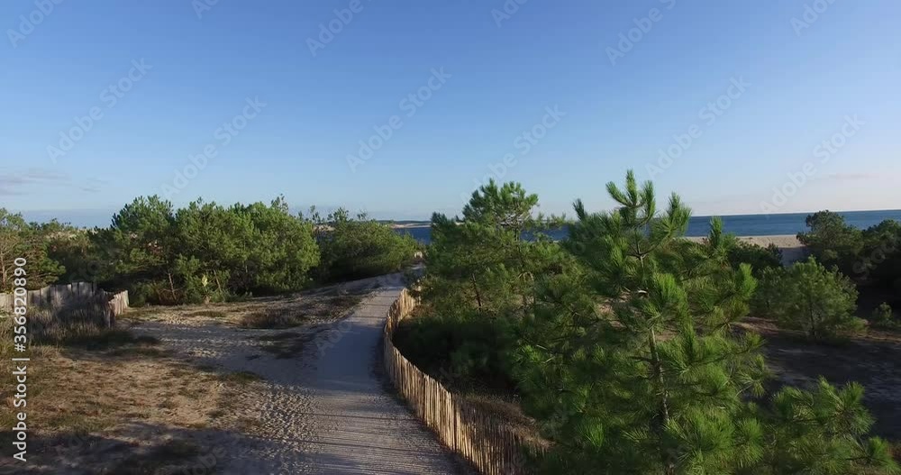 Cap Ferret Point approach at Arcachon Bassin Bay France with people at the sandy beach, Aerial flyover shot Cap Ferret Point approach at Arcachon Bassin Bay France with people at the sandy beach, Aerial flyover shot