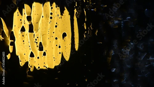 
 running water on a lighted glass