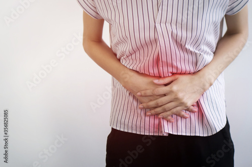 Woman having painful stomach ache