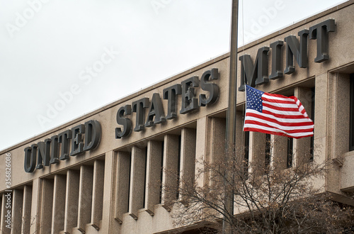United States Mint building and flag. The United States Mint is a bureau of the Department of the Treasury responsible for producing coinage for the United States