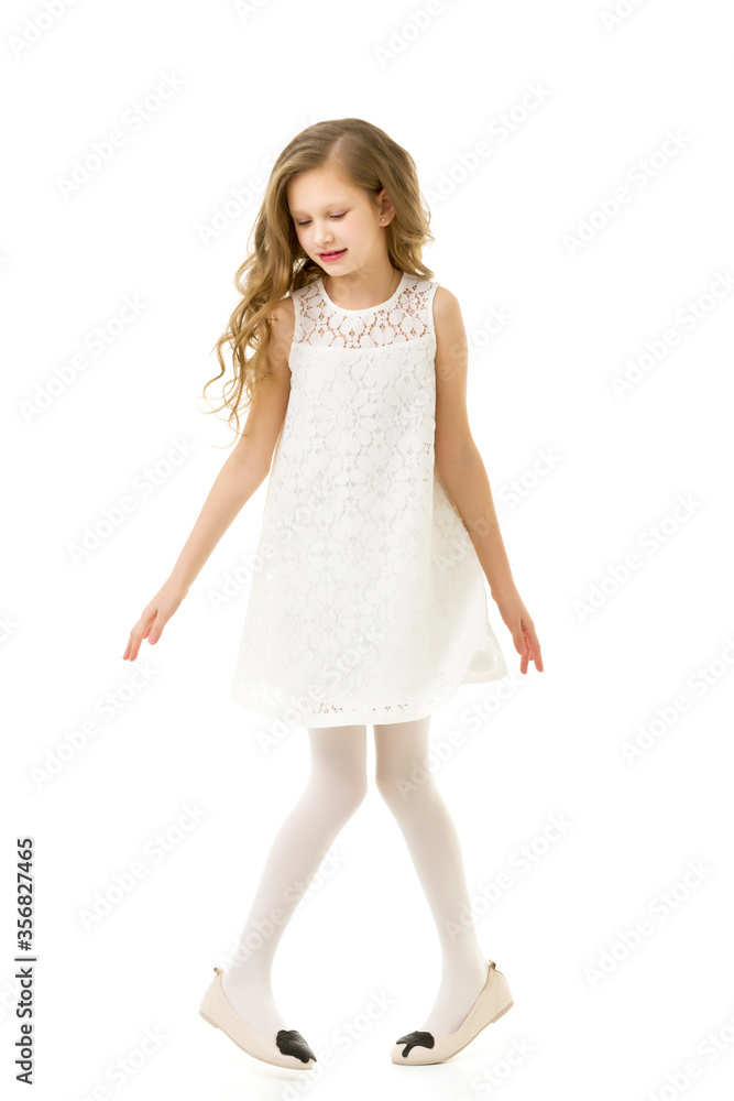 Portrait of Cute Girl Standing on Toes Slightly Crouching Her Kn