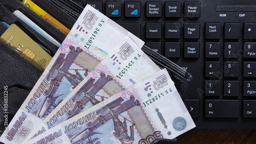 Tableau sur toile Lot with Russian rubles is on the wallet with credit cards