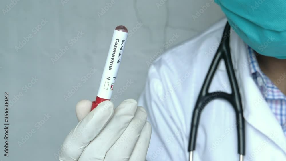 laboratory technician hand holding blood test tube laboratory technician hand holding blood test tube