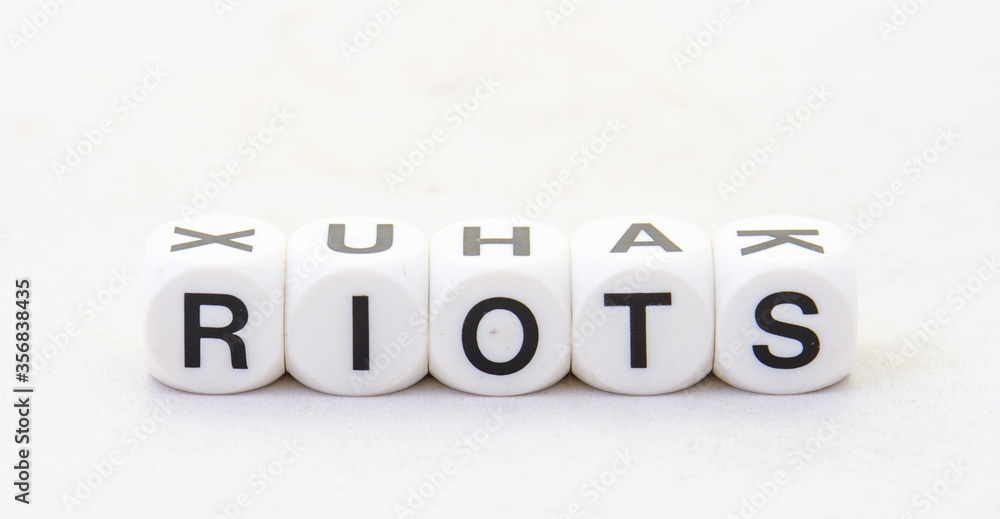 The term riots displayed visually on a clear background in black text image with copy space in horizontal format The term riots displayed visually on a clear background in black text image with copy space in horizontal format