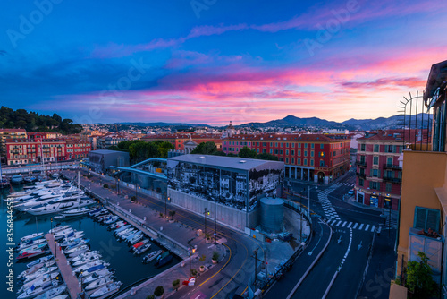 Dramatic gorgeous sunrise over the quiet town of Nice, France © ReubenTeo