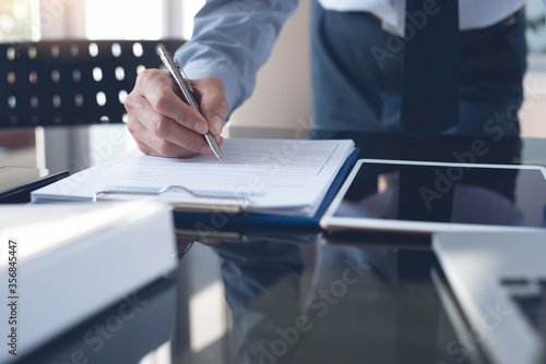 Signing business contract, paperwork document