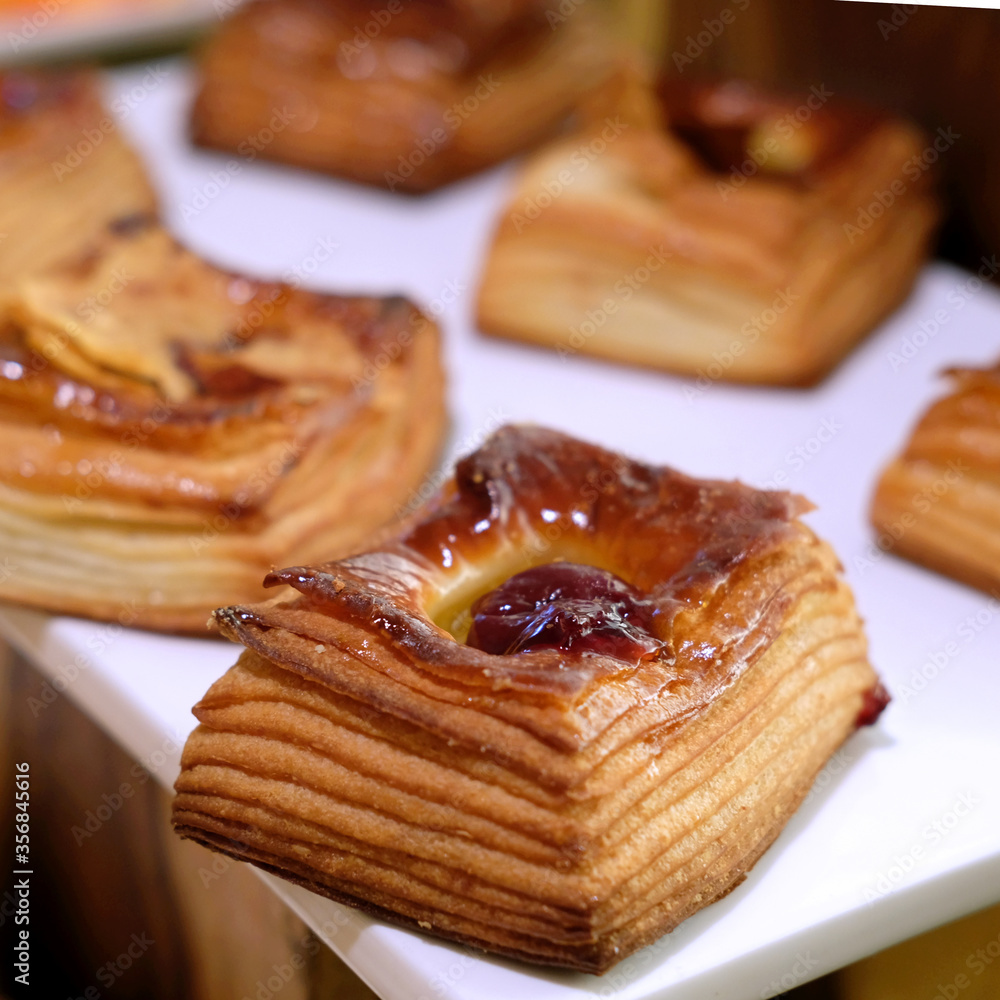 Cherry Puff Pastry with fruit and jam on a white tray Cherry Puff Pastry with fruit and jam on a white tray