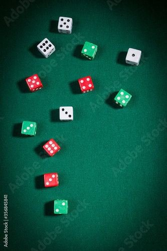 Multi-colored dice on the playing table