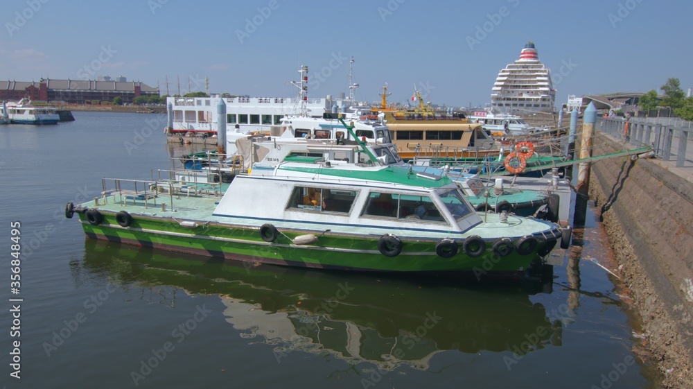 7 June 2020 Yokohama, Japan. Green fishing boat at the port of Yokohama