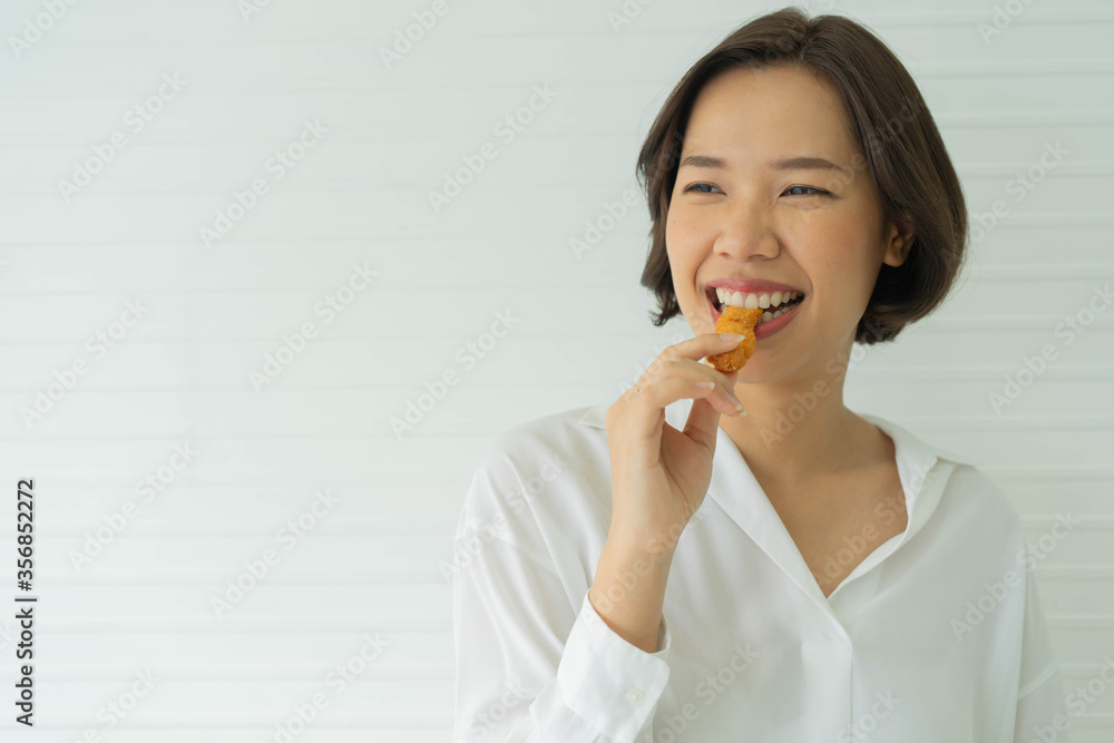 close up asian woman hold protein cereal bar to eat in the midday for health and lifestyle concept close up asian woman hold protein cereal bar to eat in the midday for health and lifestyle concept