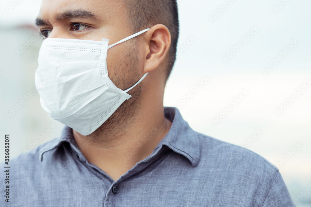 face mask. Sick infectious asian man with wearing protection medical against coronavirus portrait. close up pandemic virus disease. Health care Covid 19 outbreak contamination concept. face mask. Sick infectious asian man with wearing protection medical against coronavirus portrait. close up pandemic virus disease. Health care Covid 19 outbreak contamination concept.