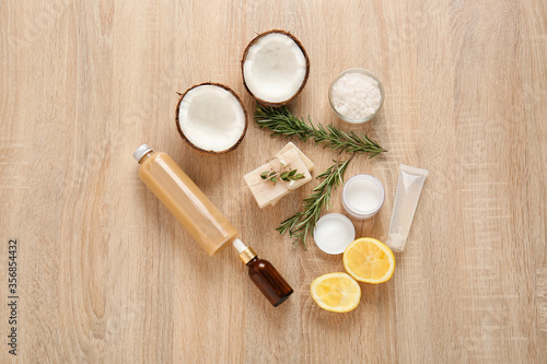 Natural cosmetics with ingredients on table