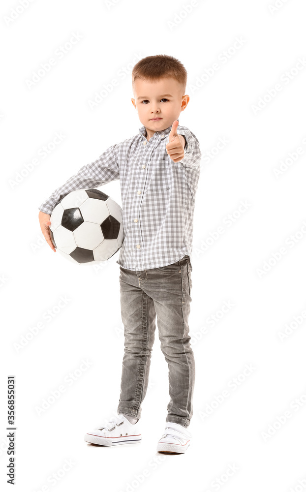 Cute little boy with ball showing thumb-up on white background Cute little boy with ball showing thumb-up on white background