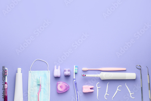 Set for oral hygiene with medical mask on color background