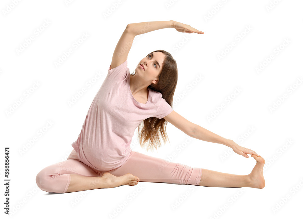 Young pregnant woman practicing yoga on white background Young pregnant woman practicing yoga on white background