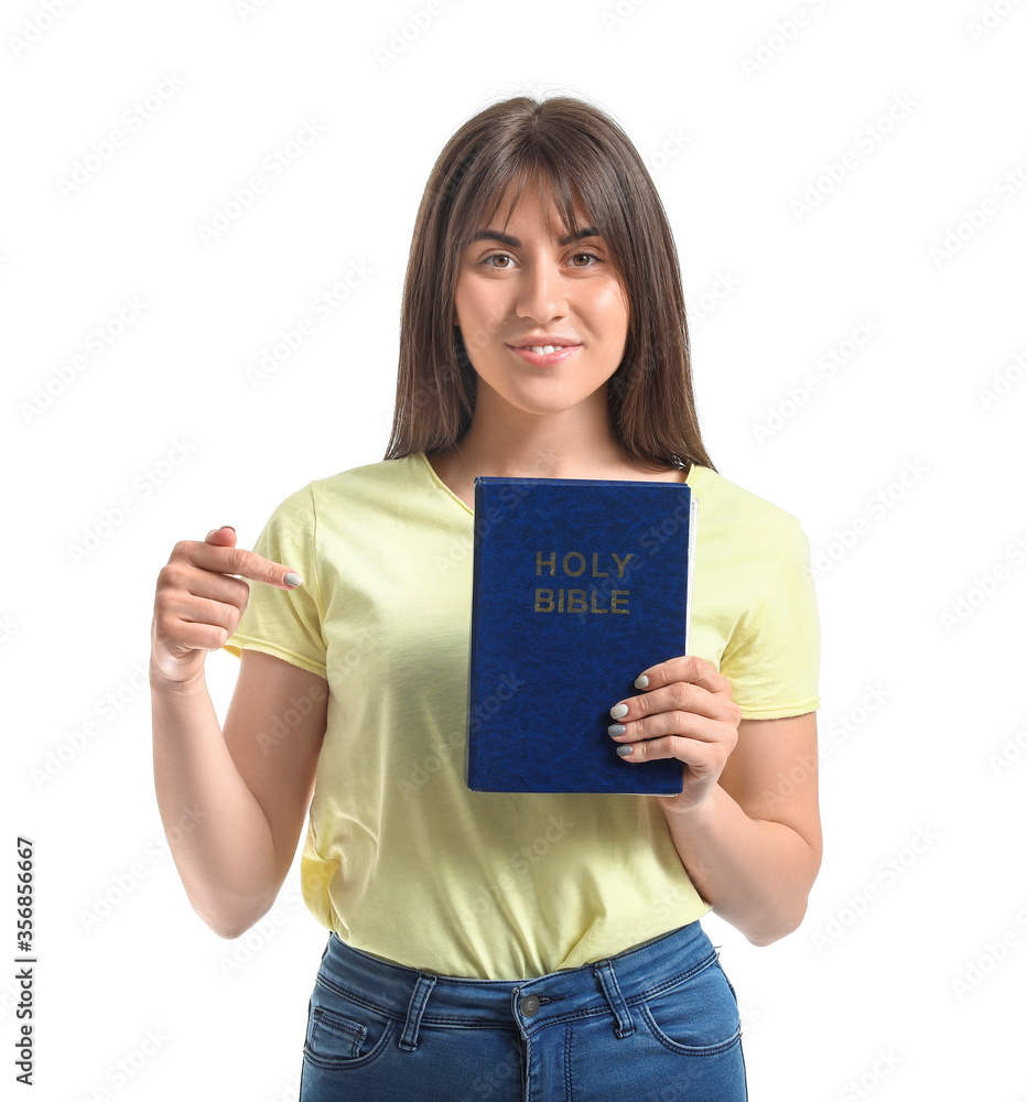 Young woman with Bible on white background Young woman with Bible on white background
