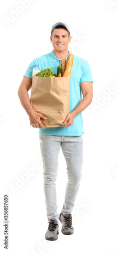 Delivery man with food in bag on white background