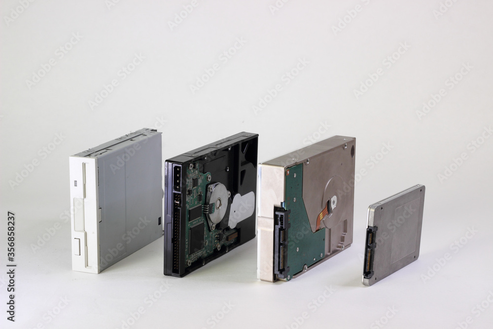 The evolution of personal computer storage devices and interfaces. From FDD or Floppy Disk Drive to SSD or Solid State Drive. Data backup concept The evolution of personal computer storage devices and interfaces. From FDD or Floppy Disk Drive to SSD or Solid State Drive. Data backup concept