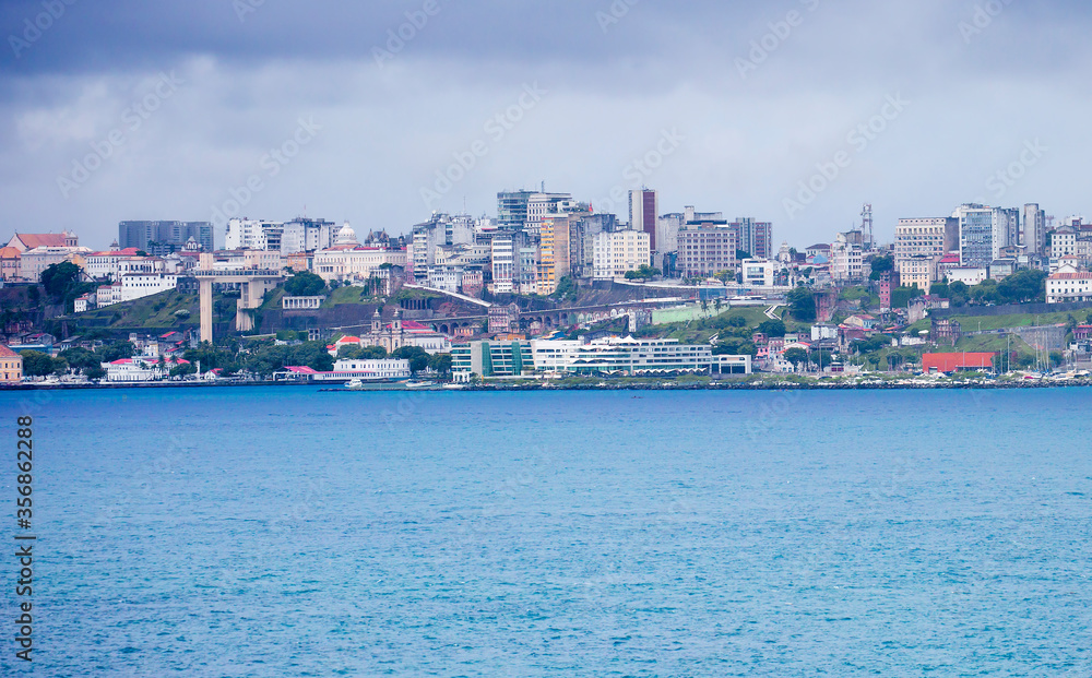 Salvador, Brazil, a view of the city from the sea.
 Salvador is a port city located in the North-East of Brazil on a small Peninsula almost triangular in shape.  The Lacerda Elevator is visible on the