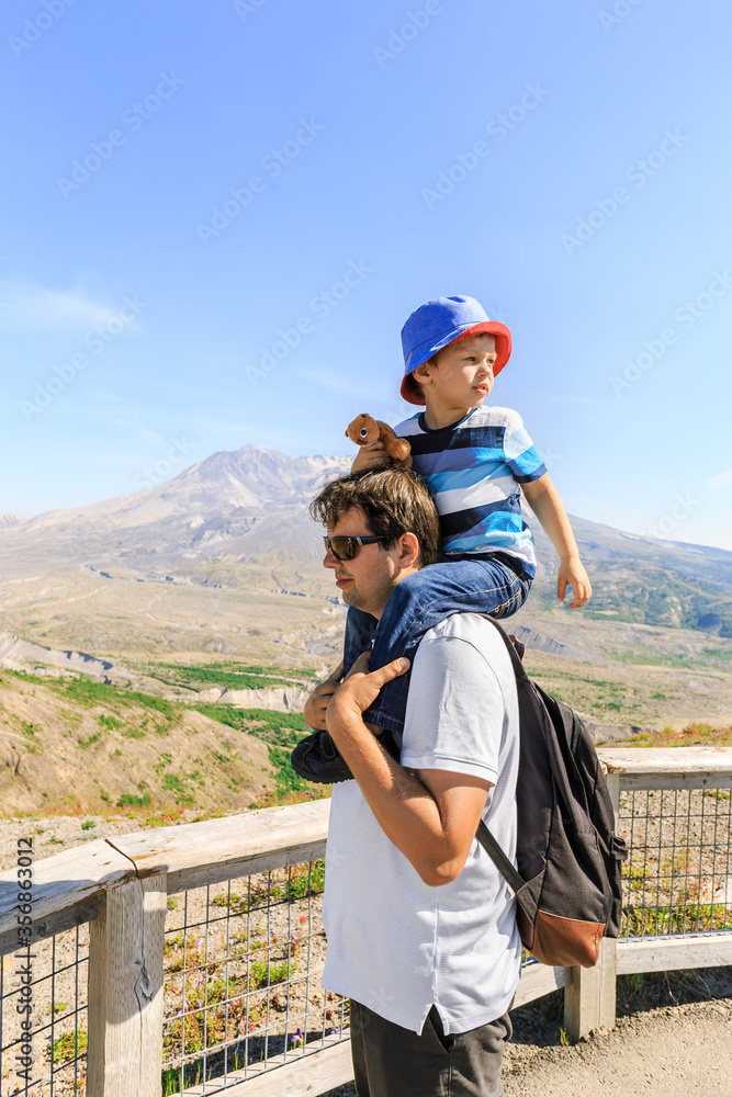 Father and son who looks back near Mt. St. Helens