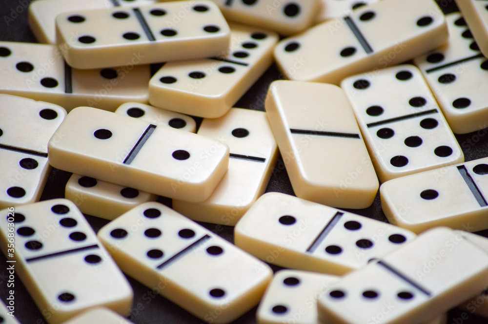 Closeup of a set of scattered domino pieces. Closeup of a set of scattered domino pieces.