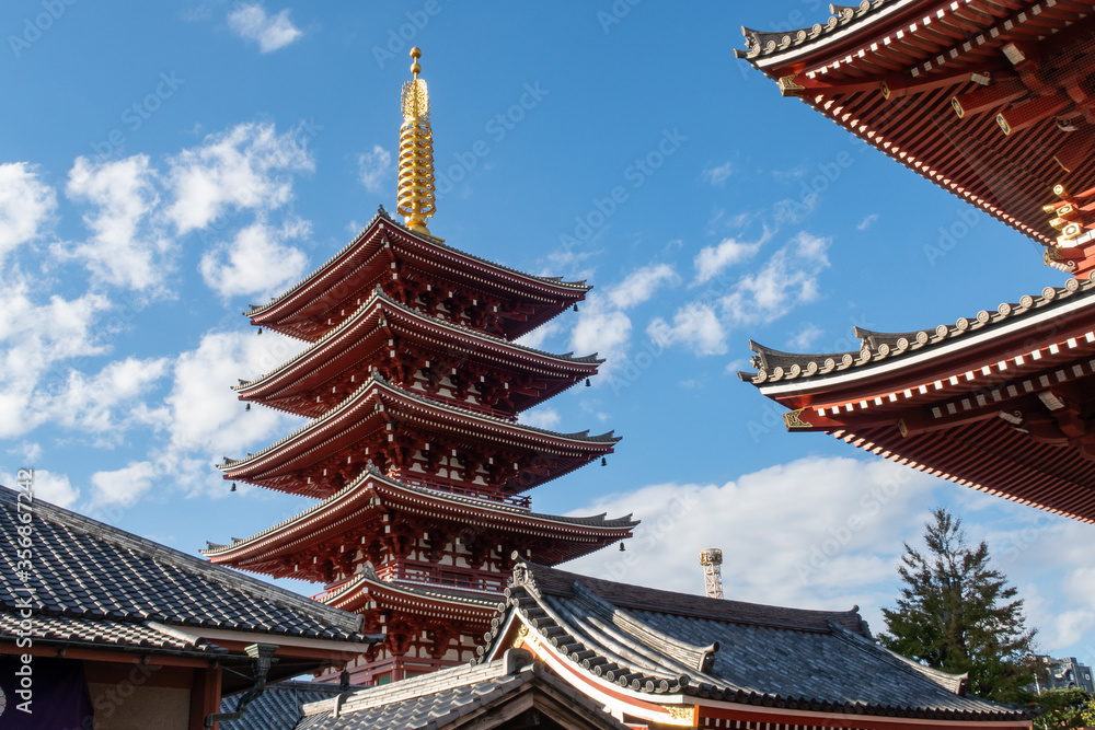 Tokyo, Japan. Red five-storied Pagoda in Sensoji Buddhist Temple with blue sky background. 