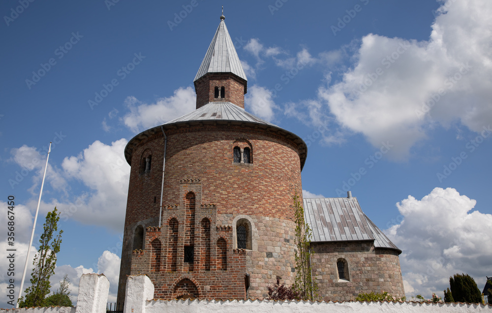 Round church with blue sky and clouds