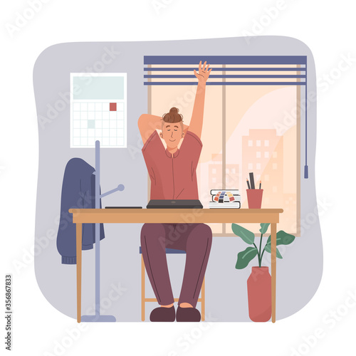 Young businessman stretching his arms at workplace