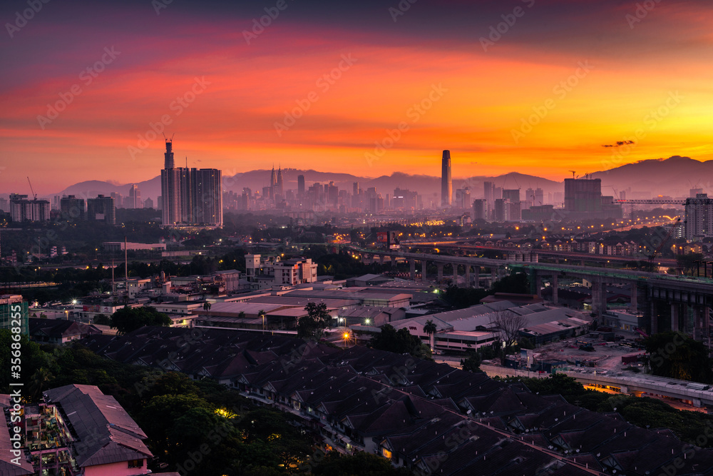 Panorama sunset Kuala Lumpur city skyline view with orange sky, Malaysia